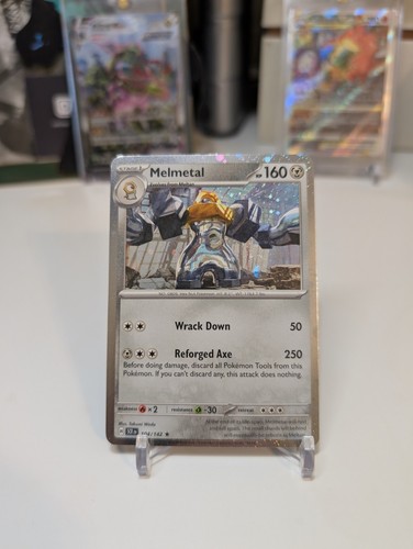 Pokémon TCG Stellar Crown Melmetal 104/142 Cosmos Holo Blister Exclusive 