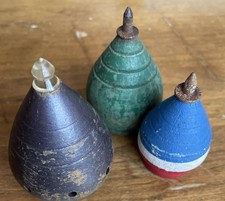 Three vintage wooden spinning tops