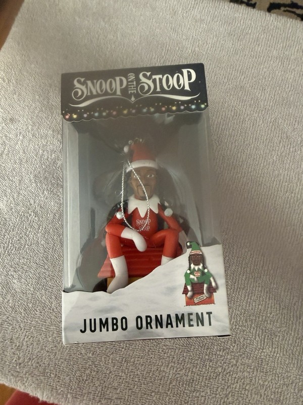 Snoop Dogg "Snoop on the Stoop" ornament features the rapper in a Santa outfit.