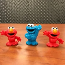 2 Hasbro 2013 Elmo and 1 Cookie Monster cake toppers