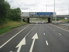 Photo A3 M8, J10, heading east Queenslie The exit for Springhill and Eas c2013