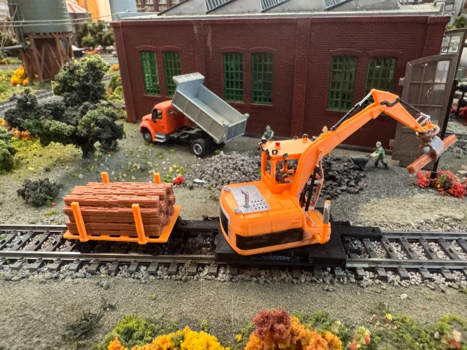 Ho scale Cat Railroad Tie Loader with loaded cart in Orange unpainted - Image 4 of 4