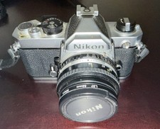 Nikon FM 35mm SLR Camera Includes Lens, Filter, Flash, and Carry Case 