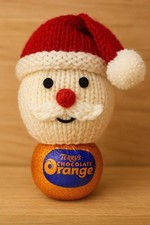 Strickanleitung Weihnachtsmann Schokolade Orange H&uuml;lle f&uuml;r Weihnachtsmann Geschenk