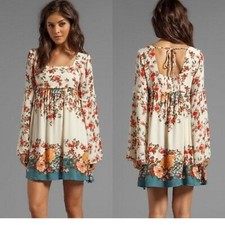 Free-people Women's Floral bell sleeve mini dress with tie back. Size medium