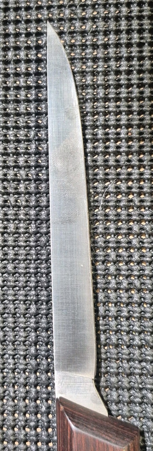 Vintage WESTERN fish fillet knife with silver blade and dark wood handle, sharpened edge, in black mesh sheath.