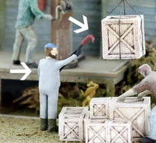 Freight Dock Worker guiding Freight WITH his FREIGHT HOOK O Finished Worker