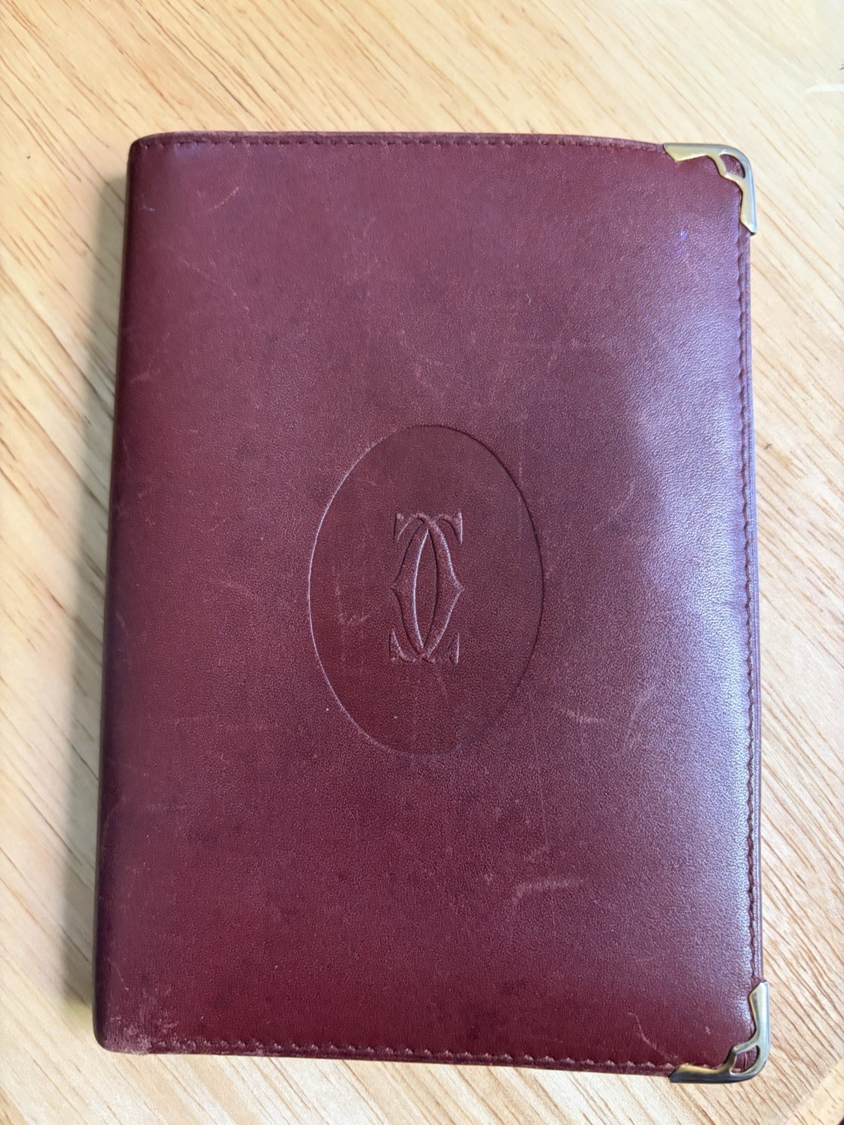 Cartier Burgundy Bifold Men'S Wallet Logo Metal Corner Credit Card Folding