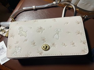 disney x coach dinky with mixed dalmatian print