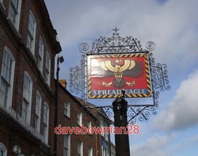 PHOTO  SPREAD EAGLE SIGN THIS IS THE HIGHLY DECORATIVE INN SIGN OUTSIDE THE WHIC