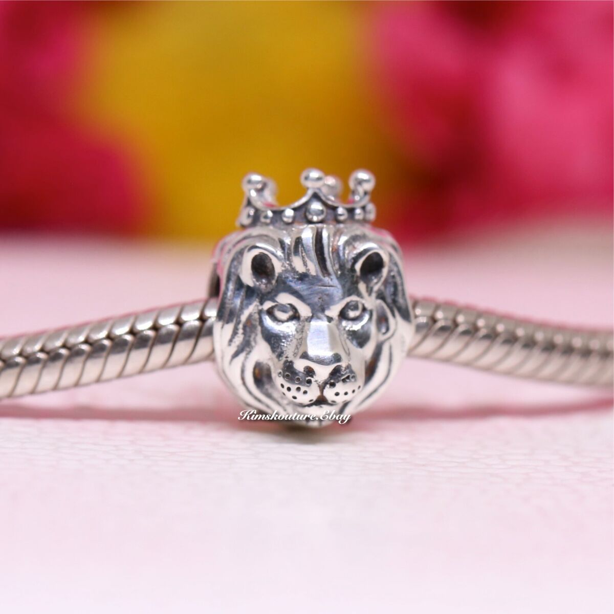 GLASS BEAD RING LIGHT BLUE W/LION CHARM GLASS BEAD RING LIGHT BLUE W/LION CHARM