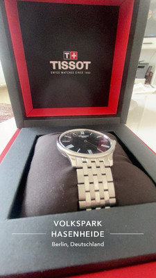 Tissot Armbanduhr Edelstahl silber/schwarz analog rund mit Original-Box