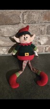Plush Hanging Christmas Elf decoration with extendable legs.