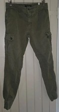 David Haward. Slim-fit, cuffed ankles, cargo pants. Olive green. W:34