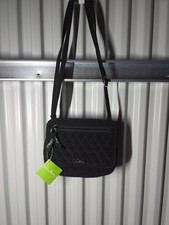 Vera Bradley crossbody bag featuring a branded fabric lining Magnetic Closure