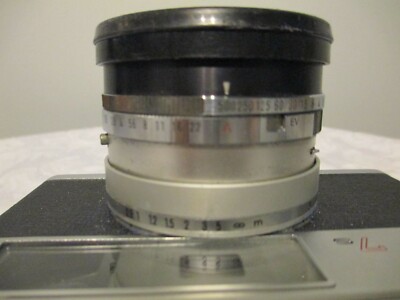 MINOLTA SRT 100B. Avec objectif MC-ROKKOR PF 1:2 - 50mm. + Sacoche. EUR