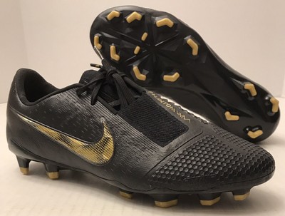 nike football boots black and gold
