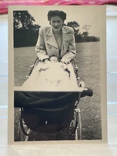 Vintage B&W Photo Of A Woman With Discolored Face Posing with Baby In A Carriage
