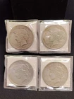 4 US Silver Peace Dollars including 1921, 1926-S, 1927-D, and 1928-S