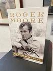 Roger Moore Signed Book "My Word is My Bond" Auto with B&E Hologram