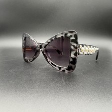 Women's gray black tortoise shell butterfly shaped sunglasses featuring pearls