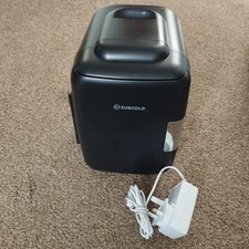 The black mini-fridge is the Subcold Classic 4L. The unit is designed for both c