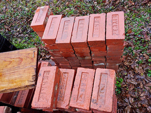 Lot of Stacked Red Clay Bricks Rectangular Shape Building Bricks