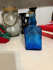 Wheaton NJ Blue Glass Paul Revere Embossed Molded Bottle w/ Cork, 1911 Small — photo 1