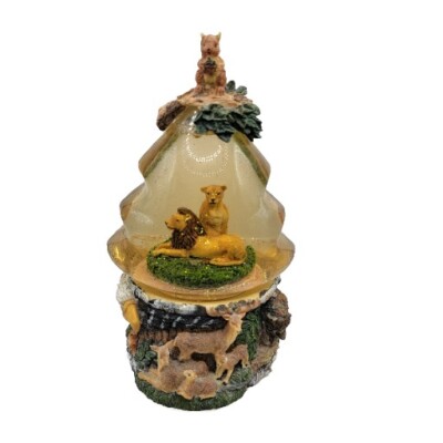 Amber colored wildlife snowglobe with Lions, Eagle, Deer, buffalo, and squirrel