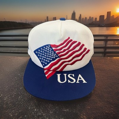 Vintage American flag design and the text ''USA'' on a contrasting blue flat brim.