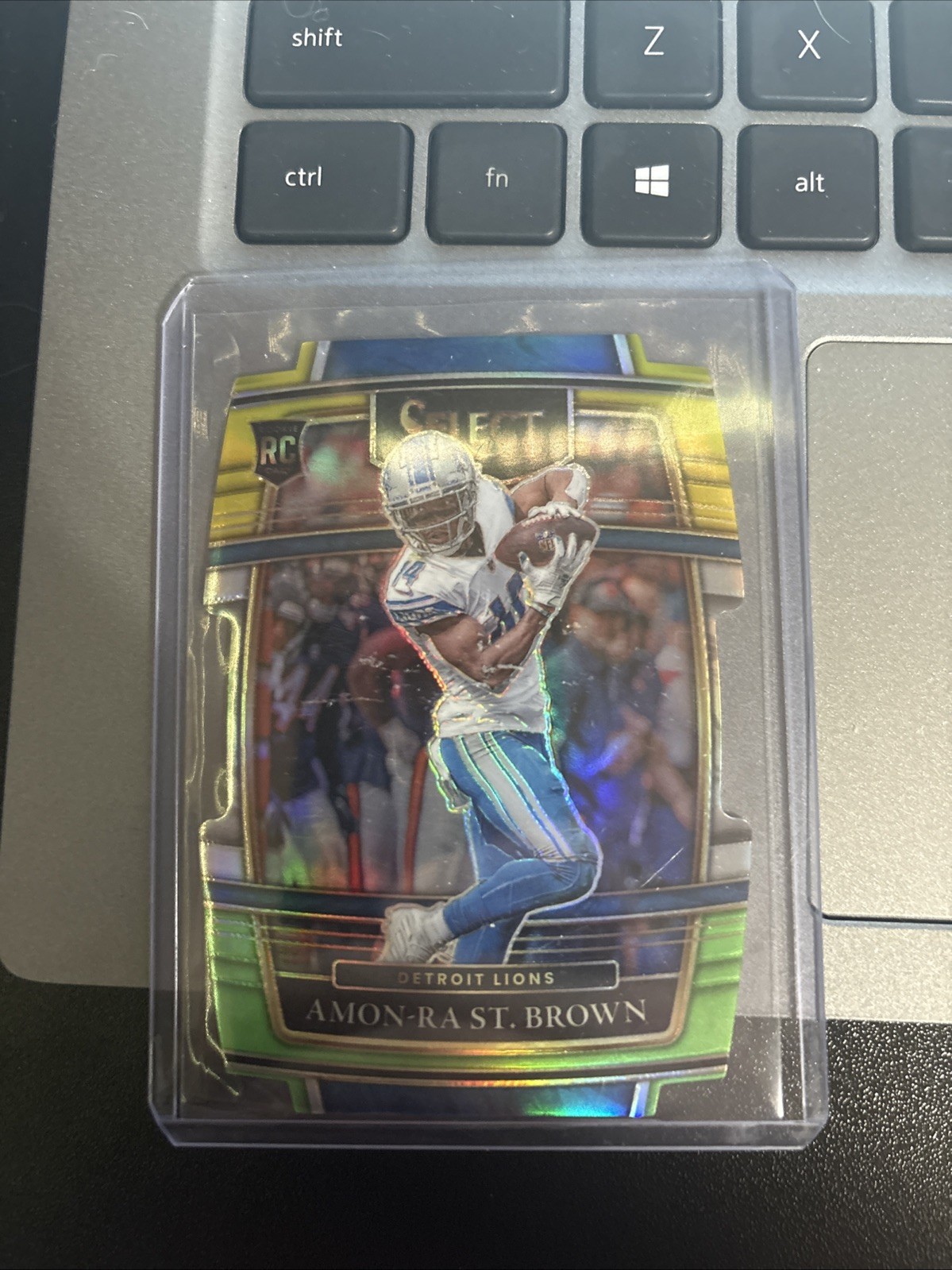 2021 Panini Select   Amon-Ra St. Brown #73 Green & Yellow Prizm Die-Cut (RC)