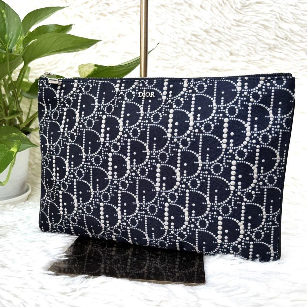 Pochette pochette trotteur Christian Dior bleu marine logo oblique nylon occasion 17x25cm
