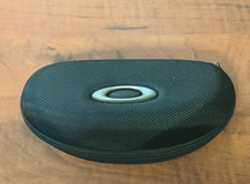 Oakley clamshell case, black with zipper closure. Excellent condition.