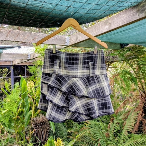 Black and white plaid mini skirt with ruffles