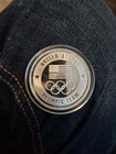 Team USA ONE TROY OUNCE . 999 FINE SILVER  OLYMPIC COIN IN CAPSULE