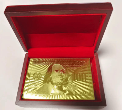 All gold playing cards in box