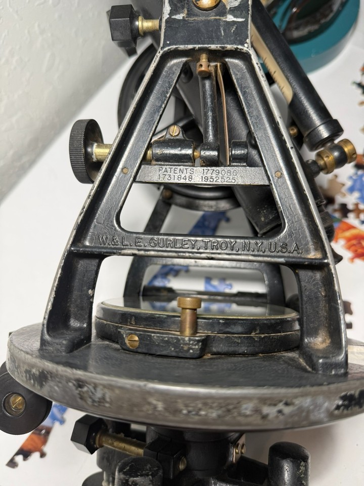 An 80-year-old surveying transit from a legendary American instrument maker — a beautifully aged brass-and-steel piece of working Americana history.
