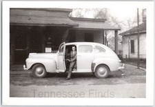 1945 Photo Of A Man Showing Off His Super Deluxe Tudor Sedan Black And White