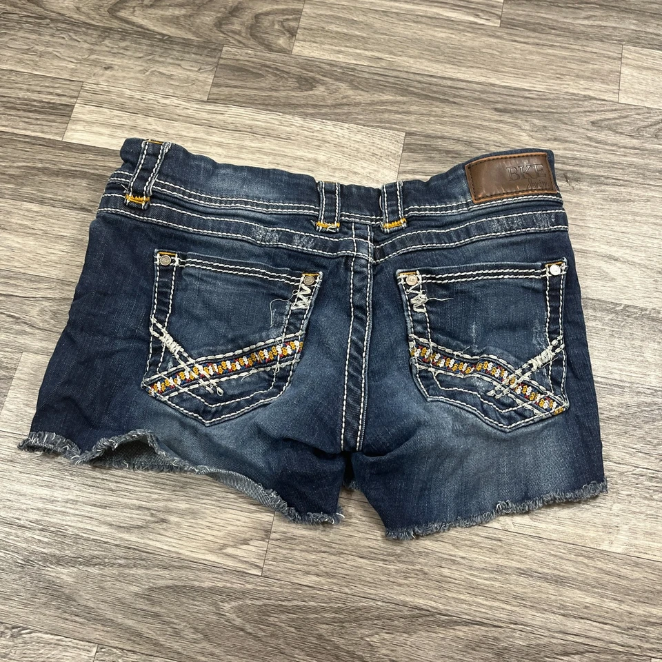 Pantalones cortos de mezclilla BKE Stella tiro bajo lavado oscuro elástico azul para mujer talla 29 Foto 4 de 4