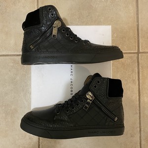 black high top leather shoes