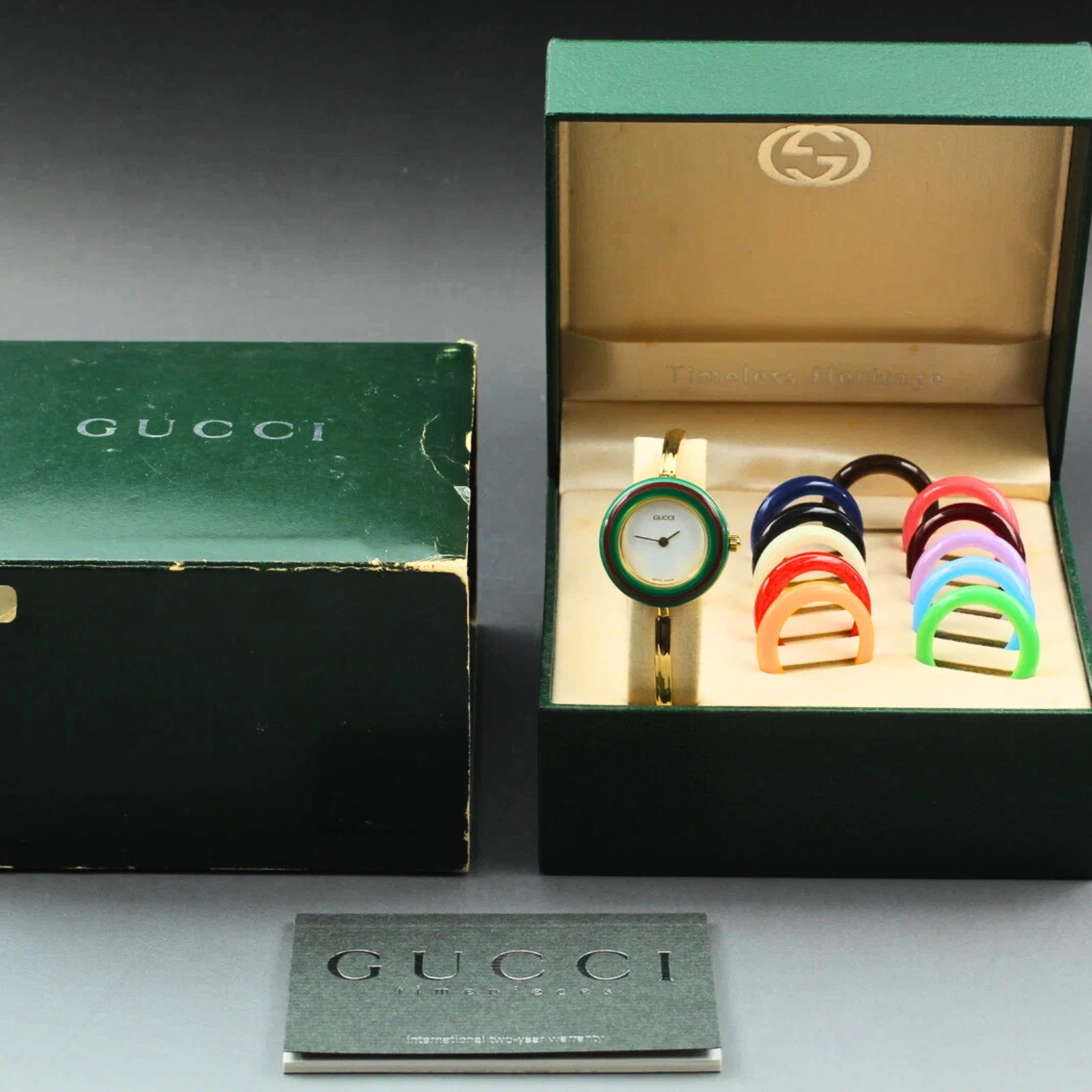 Montre femme vintage quasi neuve pile Gucci lunette à changement 11/12,2 6 couleurs