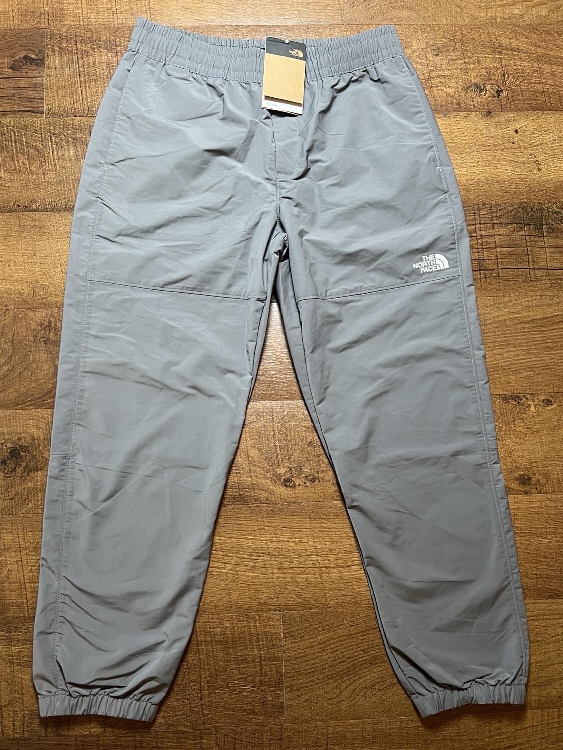 Pantalones de viento fácil The North Face para hombre nuevos con etiquetas en gris perla ahumado - medianos - 34X30