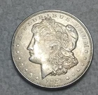 1921 Morgan Silver Dollar. Estimated Mint State 63. Light Toning. Video M0008.
