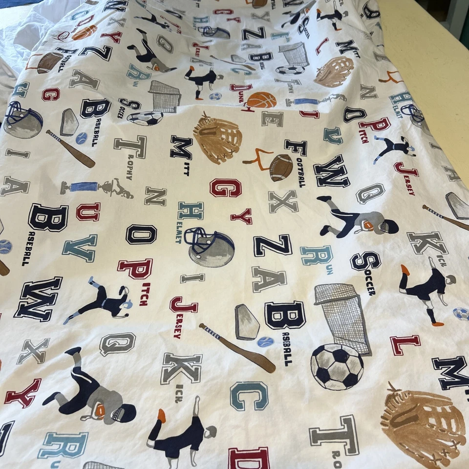 Sábana bajera y falda de cama azul liso Pottery Barn para cuna deportiva para niños Foto 4 de 4