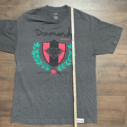 Gray Diamond Supply Co. T-shirt with black/red diamond logo, green laurel, and “GET YOUR SHINE ON” text.