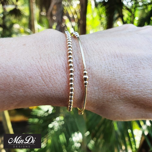Juego de dos pulseras elásticas rellenas de oro amarillo de 14 K. - Imagen 3 de 5