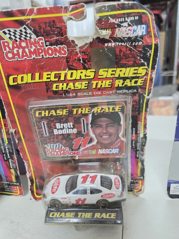 Racing Champions 1:64 NASCAR 1997 Chevy Brett Bodine #11 Chase the Race Stand