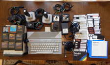 Atari 130xe Computer w/ floppy drive 1050 Cartridges game lot Joystick , paddle