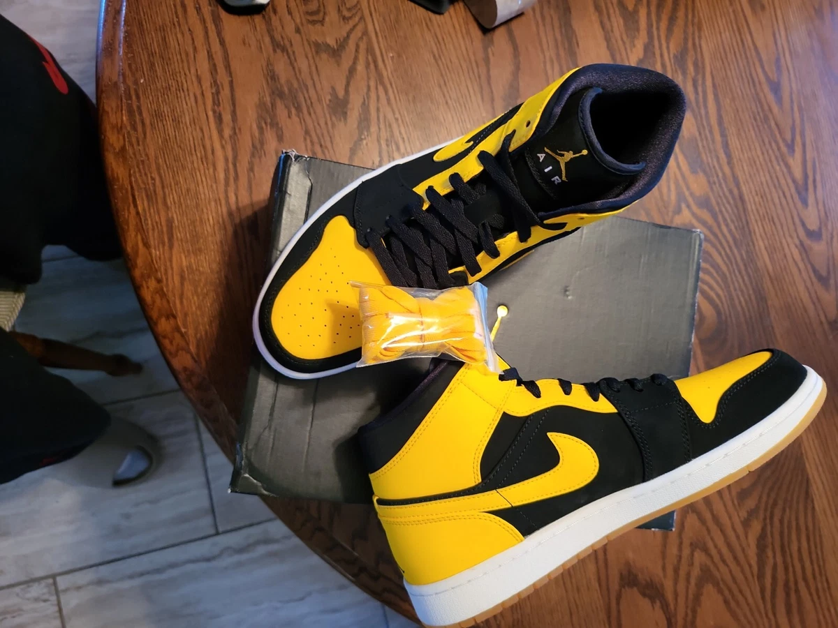 Celebs wearing jordan retro 1 mid black varsity maize-white