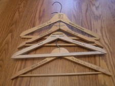 17 wooden hangers, some vintage